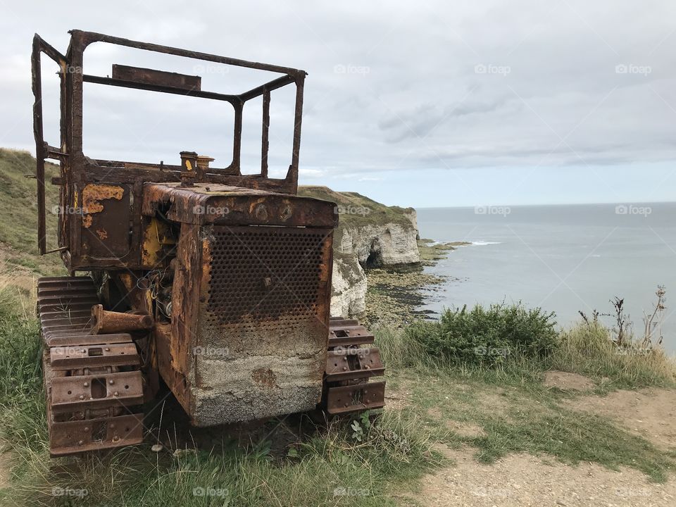Rusty industrial seaside tractor is 