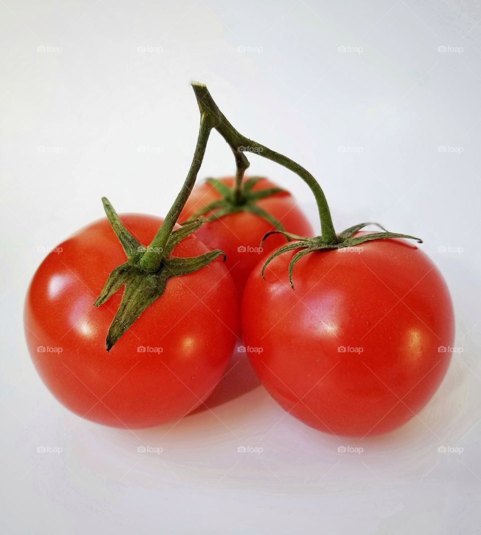 The power of three - three red tomatoes