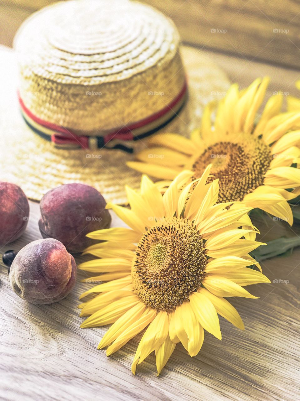 sunflowers, hat and peaches