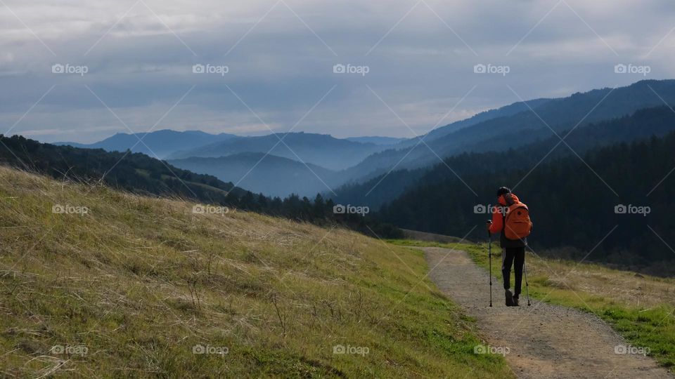 Hiker heading towards the mountains.