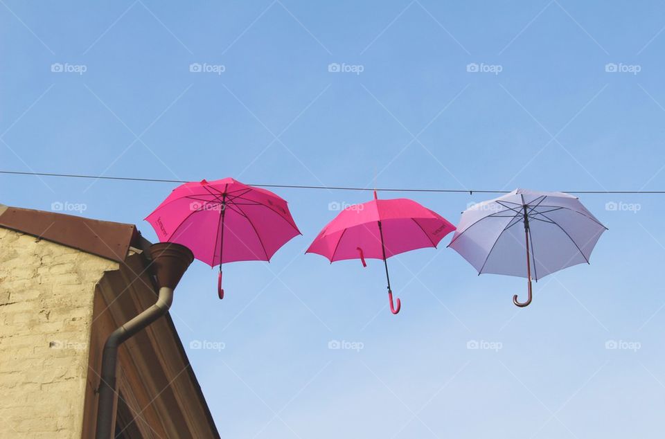 Three umbrellas in the sky.