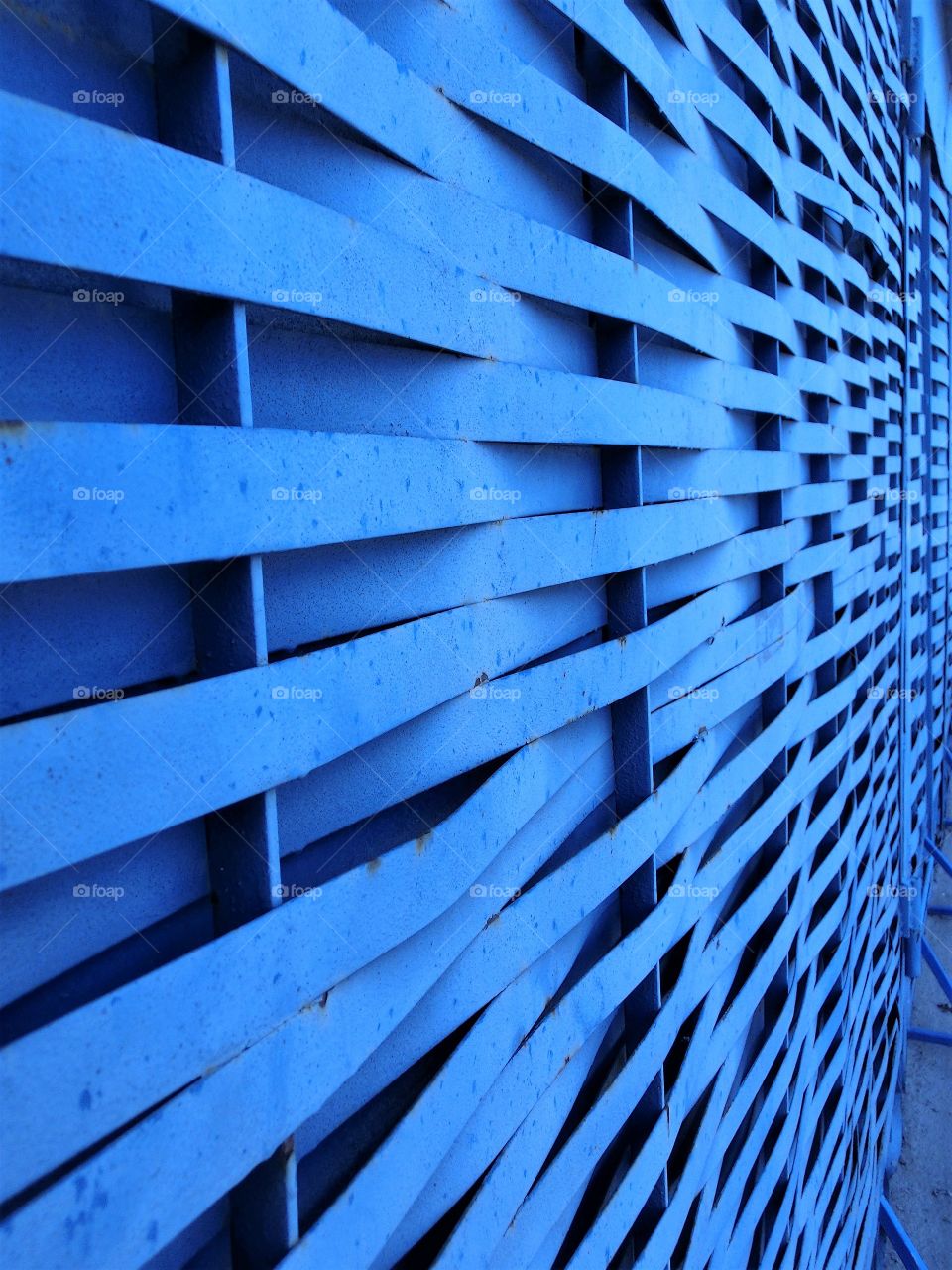 Close-up of blue fence