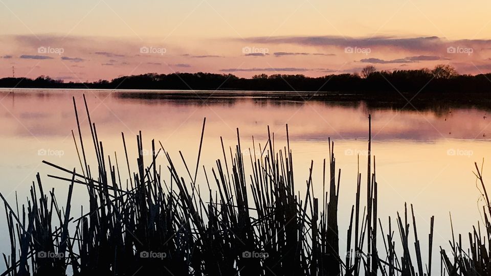 Gorgeous night in this small town beach area with sun setting below the horizon. 