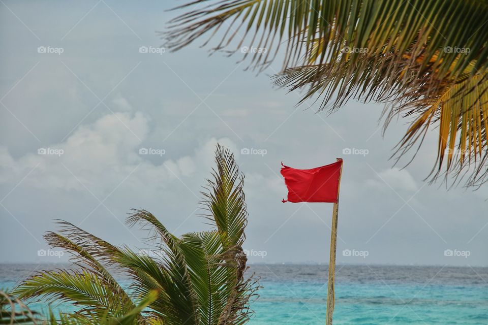 red flag on the caribbean sea