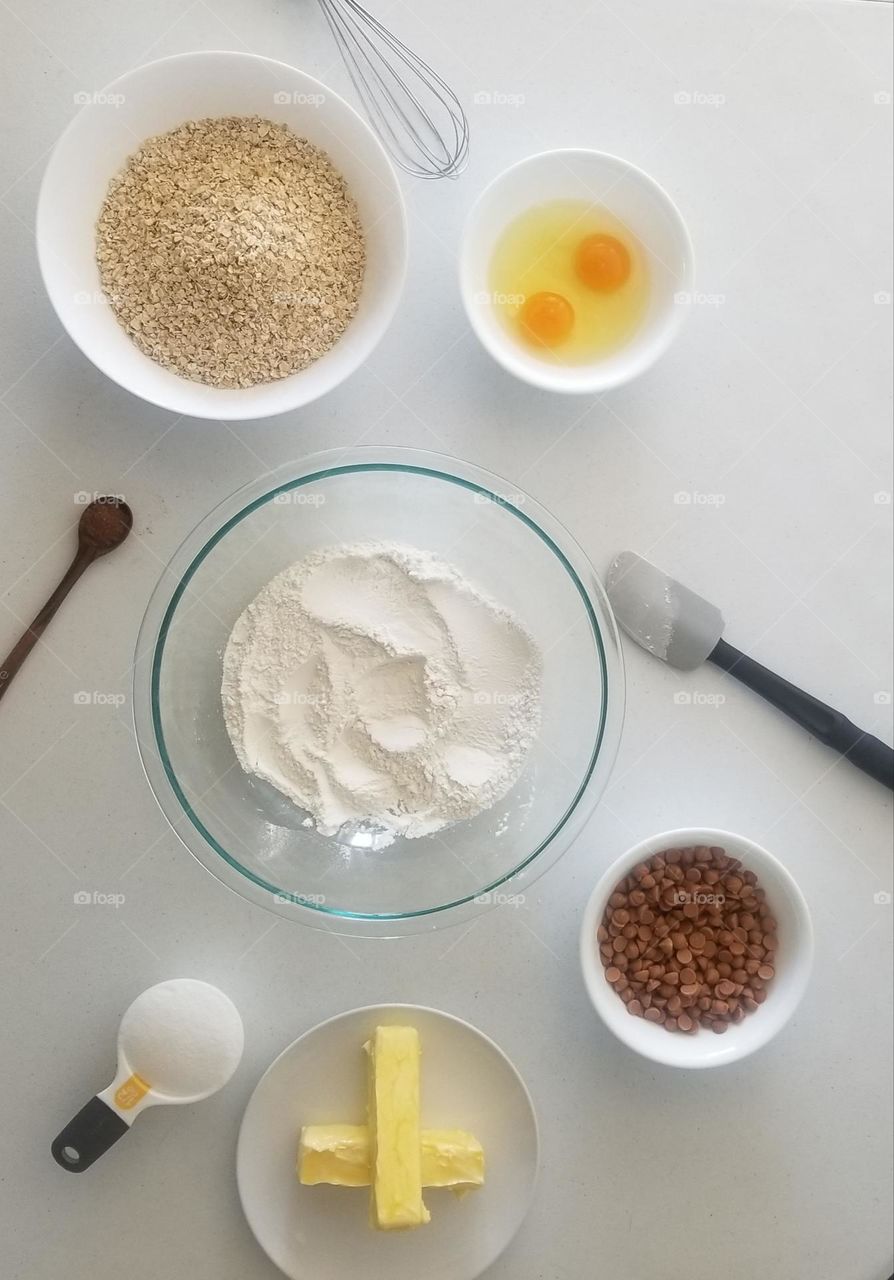 Baking ingredients arranged on a white background