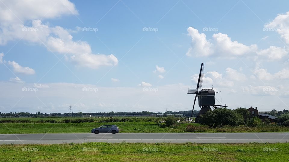 A windmill beside the A2 motorway south of Amsterdam, the Netherlands
