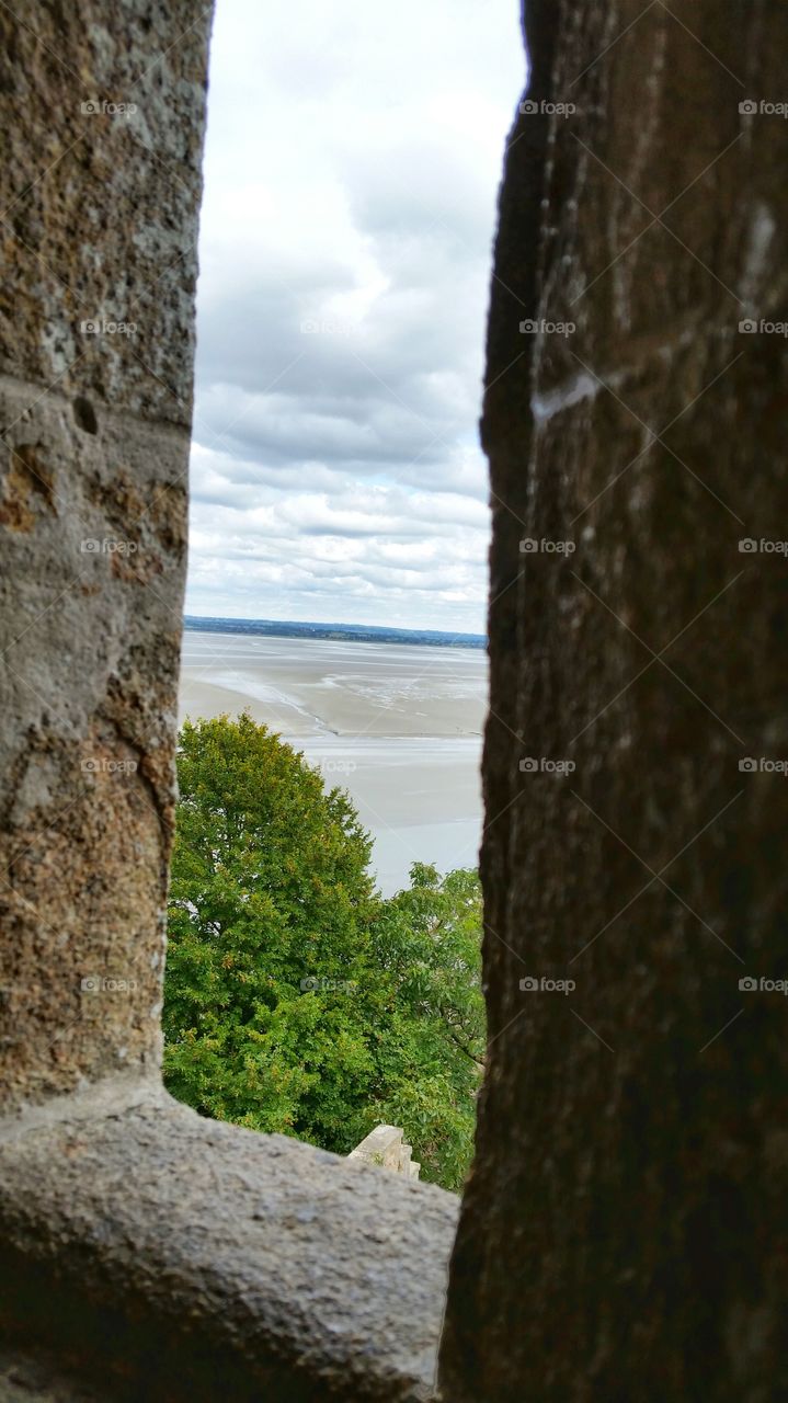 View from the stone window of Mont Saint Michel in France