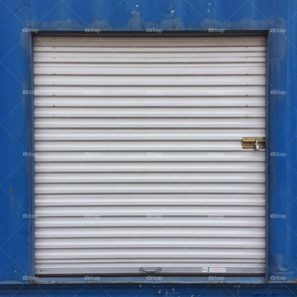 Corrugated metal storage locker door