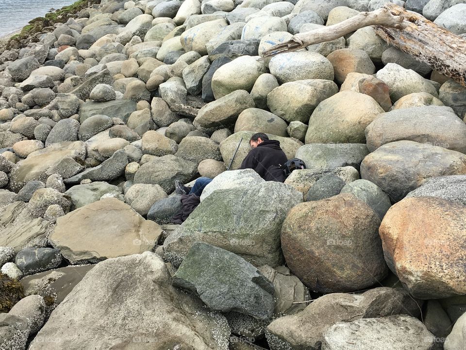 Man sleeping on rocks