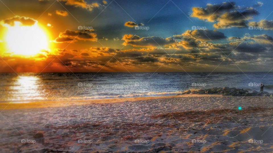 Scenic view of sunset at sea