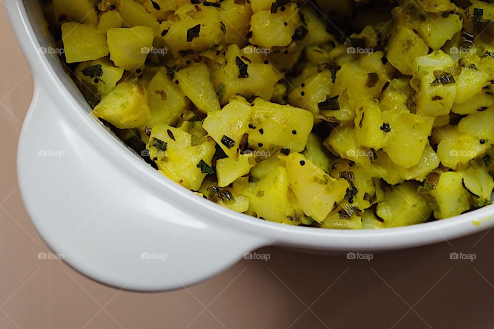 Potato Curry, Potatoes with Indians spices, Potatoes prepares with Indian spices, Bombay spices, Delicious potato recipe, cooking in the kitchen, still life with food, colorful foods, cooking Indian food, vegetarian Indian food 
