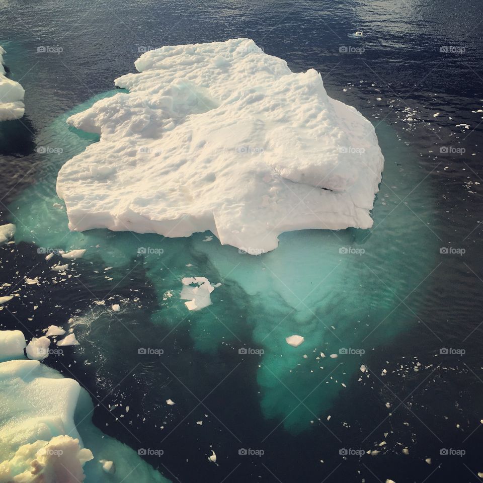An iceberg showing what truly lies under the surface of the water. 
