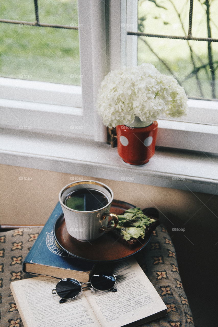 avocado toast, flowers, book and coffee, breakfast time