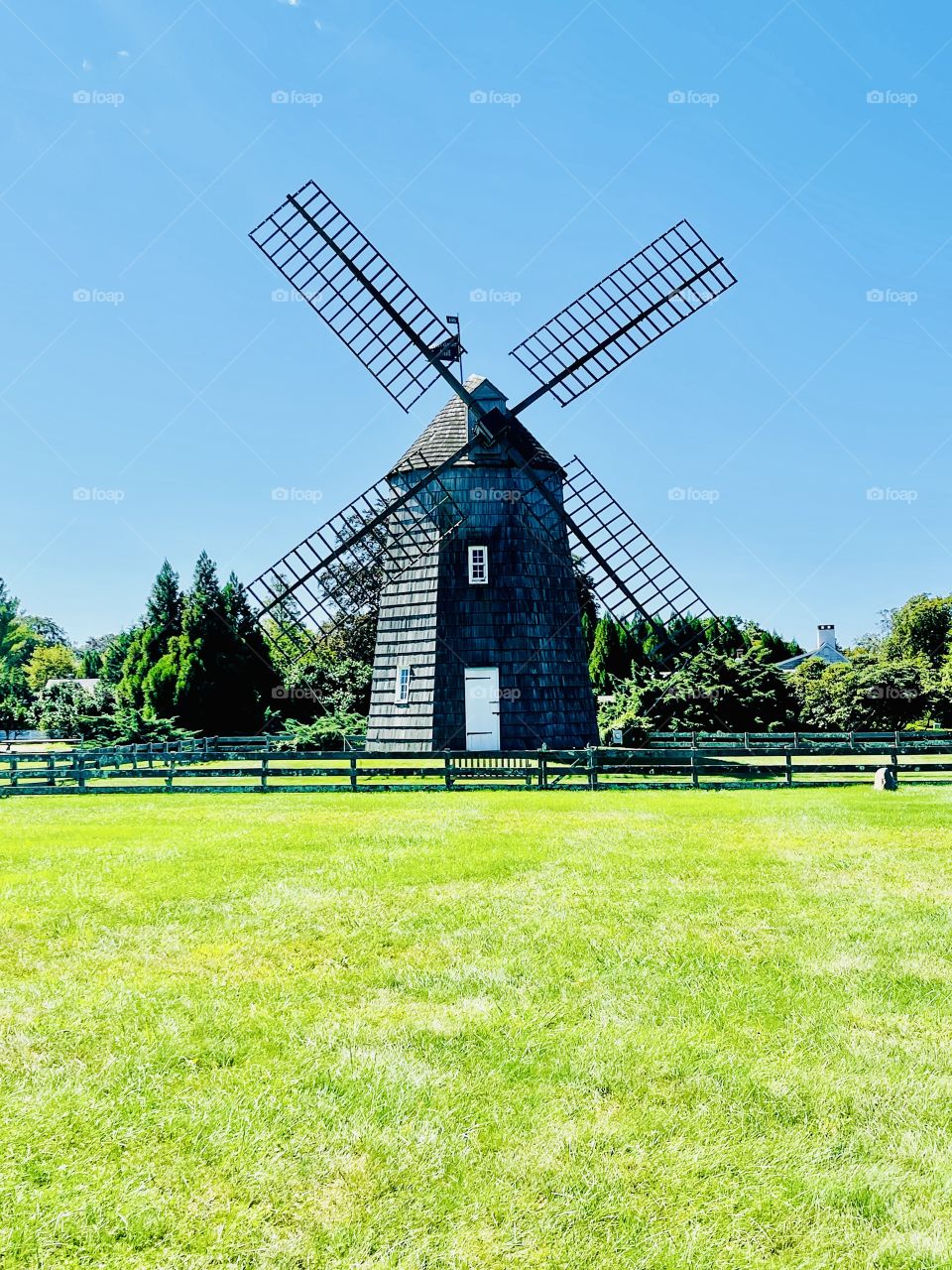 This rural landscape is graced with this historic wooden windmill that dates back to the 1800s. Once considered farm equipments they are now regarded as graceful and charming relics.
