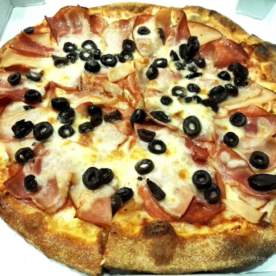 pizza with bacon, black olives and onion