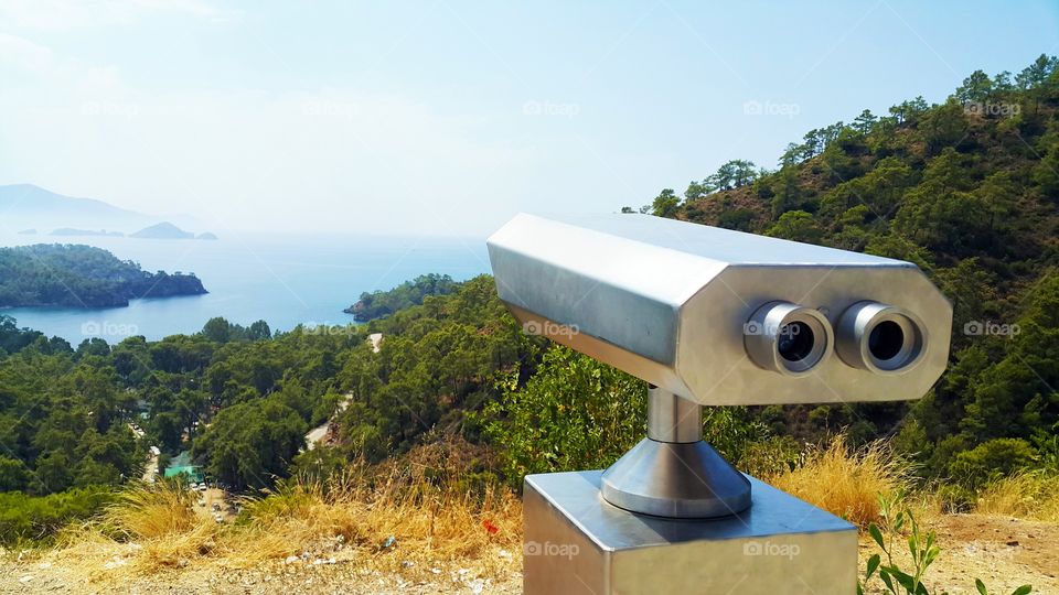 watch ocean with binoculars