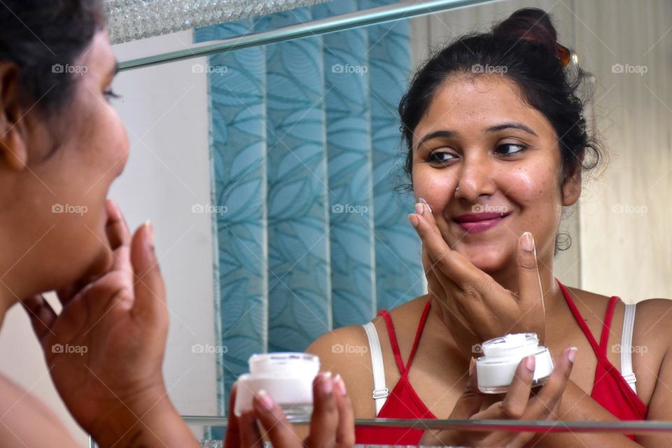 Woman applying cream