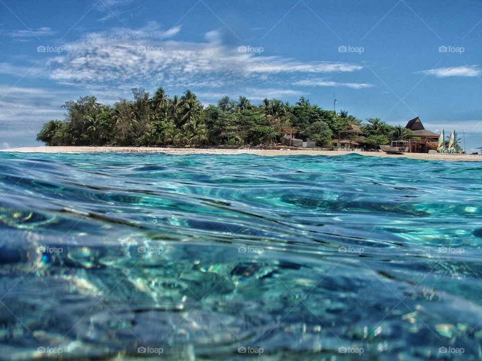 Island view from the clear ocean