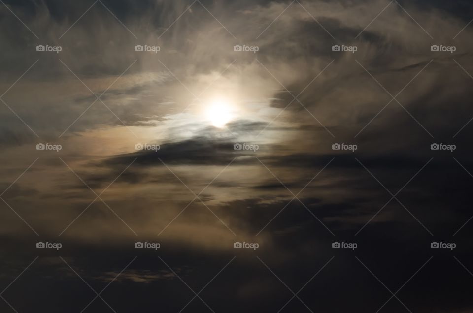 Clouds and setting sun background 