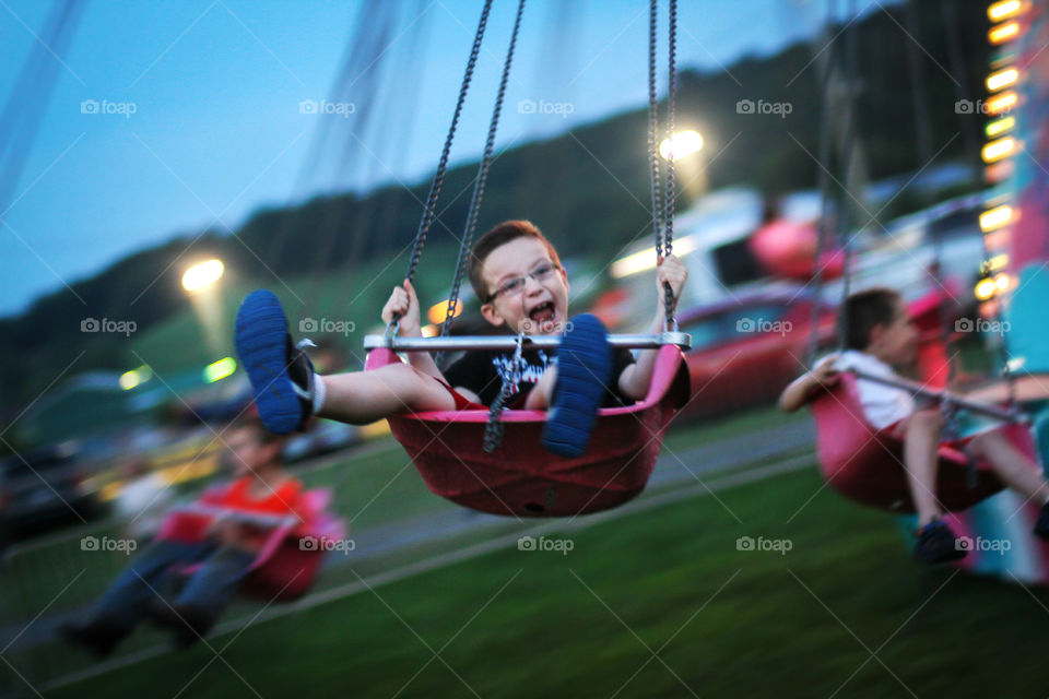 Boy enjoying the carousel ride