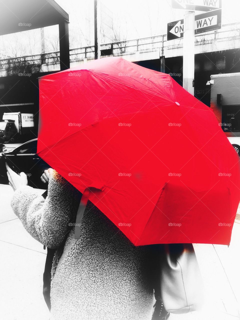 Woman holding red umbrella in Greenwich Village New York City 