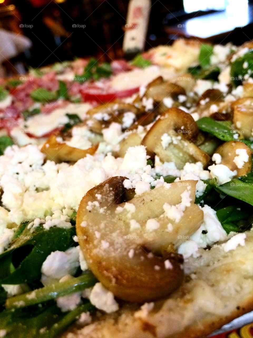 Mushroom Pizza. Delicious details on a mushroom and spinach feta pizzaz 