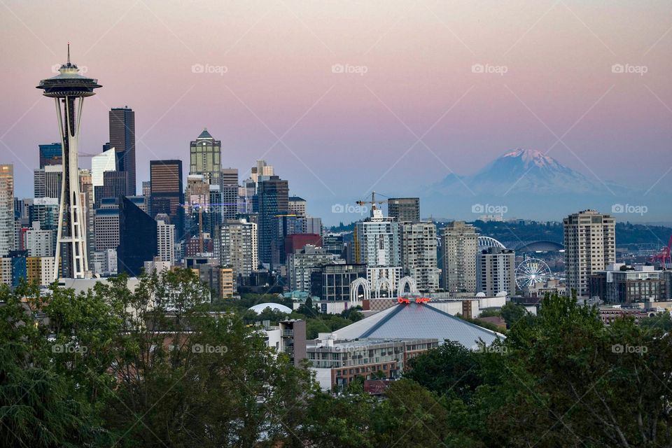 Sunset over downtown Seattle with Mt. Rainier overlooking the city. Shot from Kerry Park. 