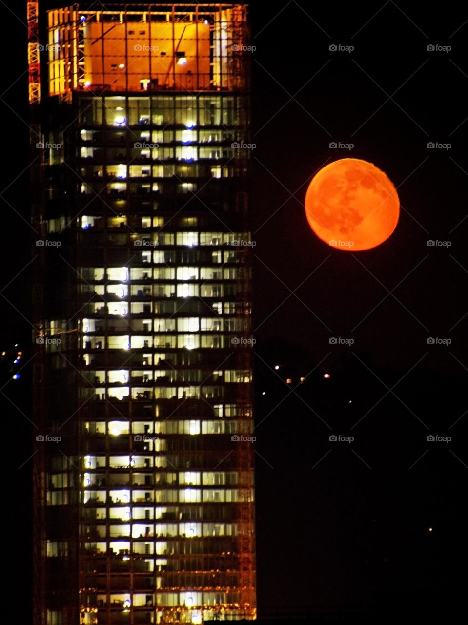 the skyscraper and the full moon