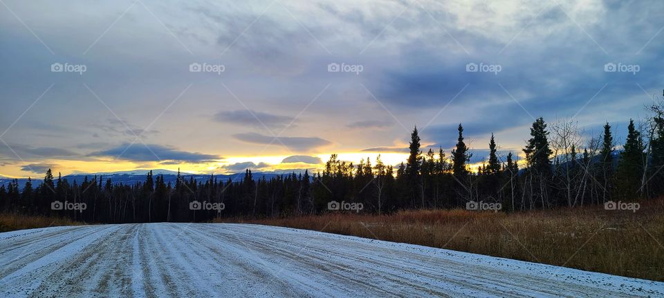 Snow covered roads and sunsets