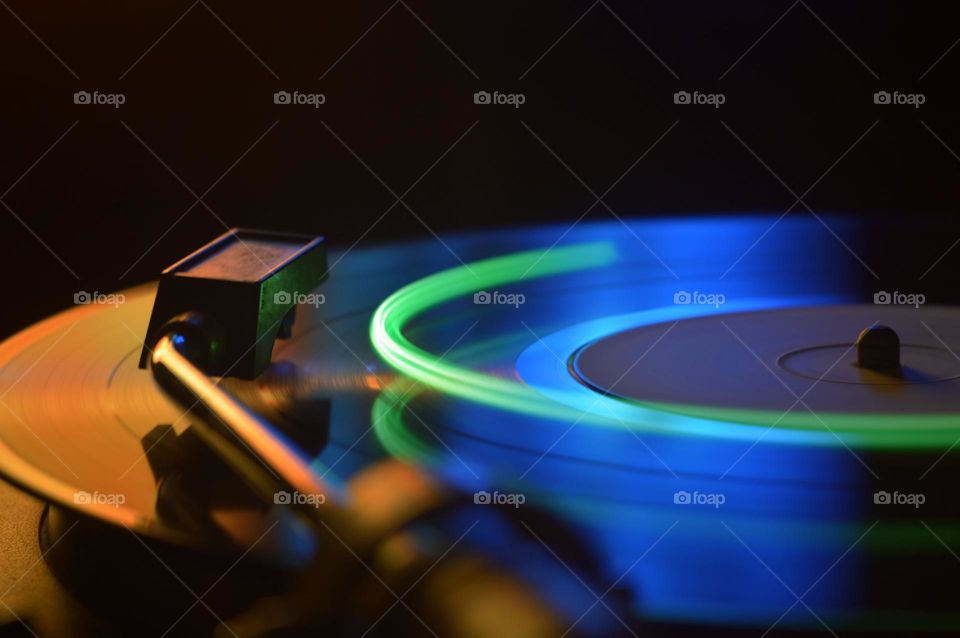 gramophone vinyl record in the dark with a light bulb shot at a shutter speed of 1.3 seconds.