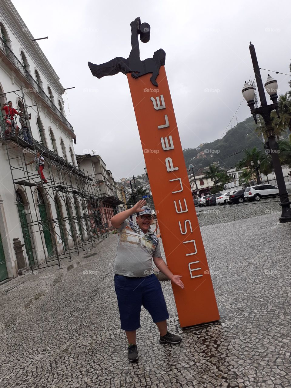 man in front of the skin museum