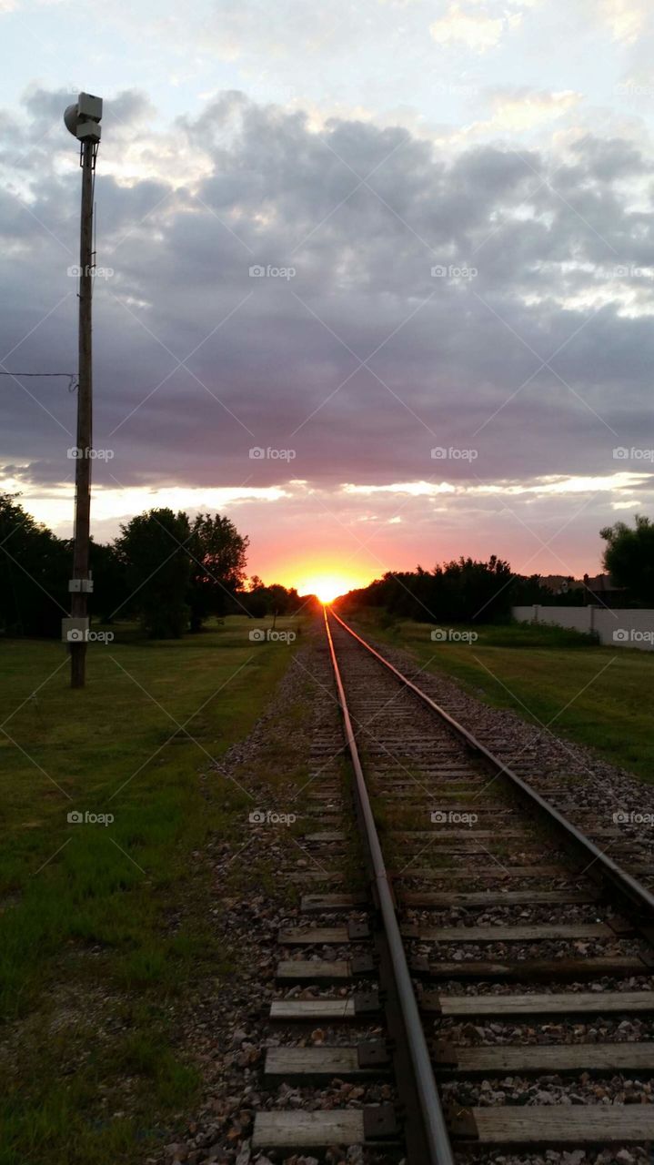 Kansas sunrise on the railroad tracks. . This was my view on a morning run. I had to stop and take a picture.