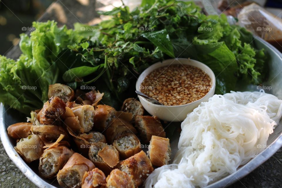 Fried spring rolls served with fresh herbs, vietnam food

