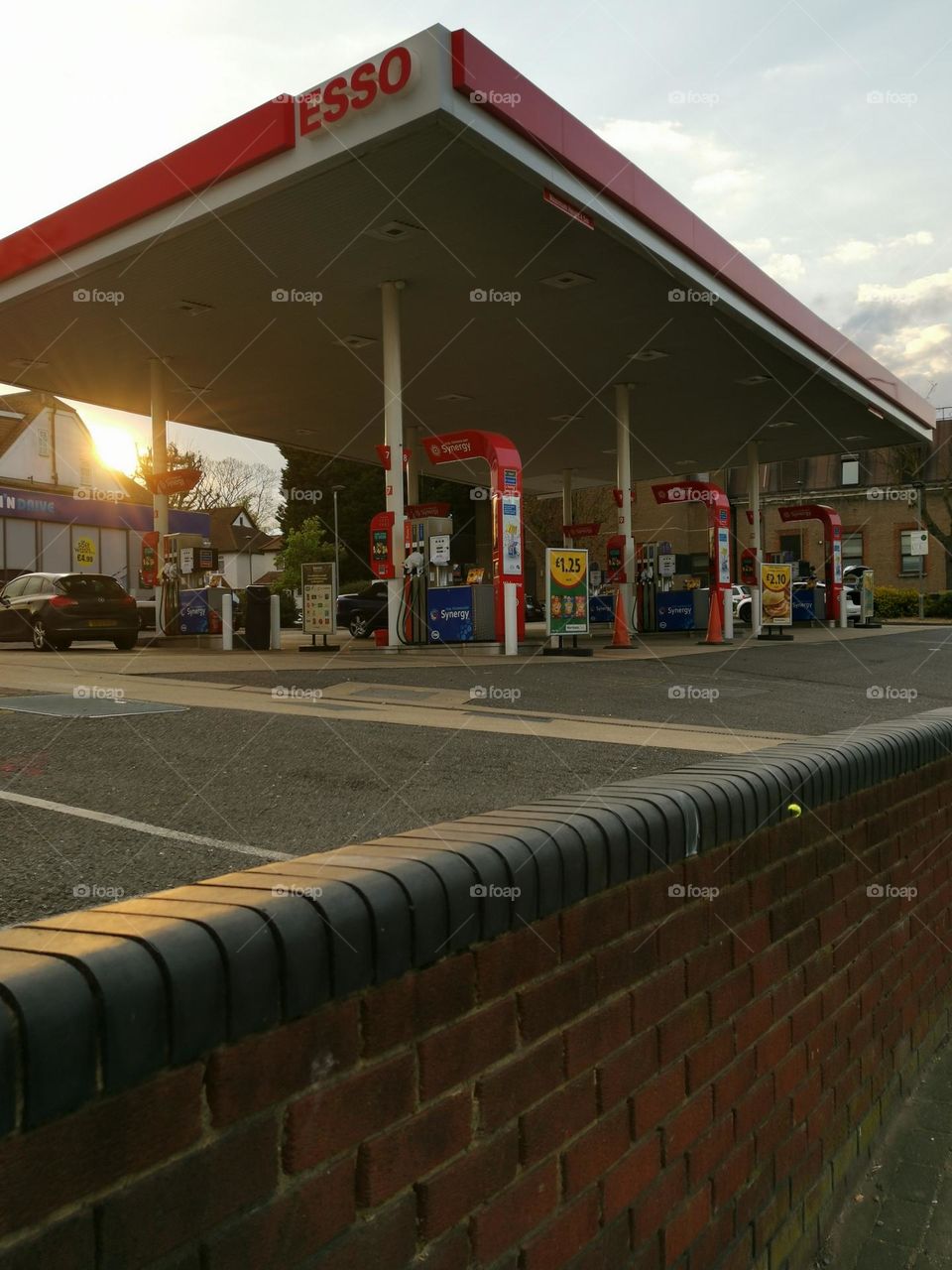 Photo of ESSO gas station. The price of fuel is rising... ESSO gas station in the city.