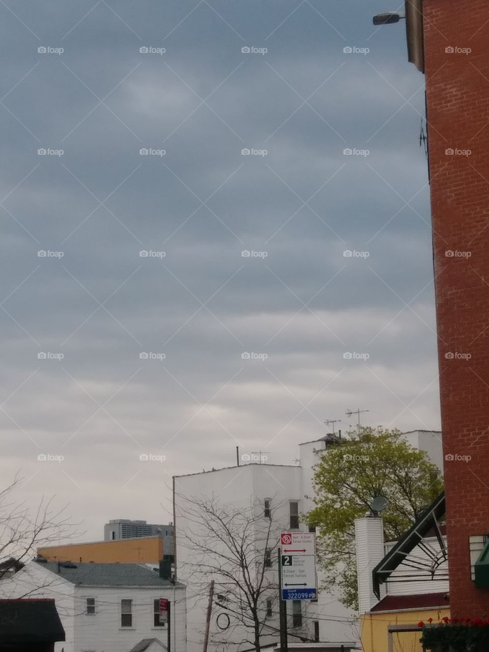 building's in distance stormy sky