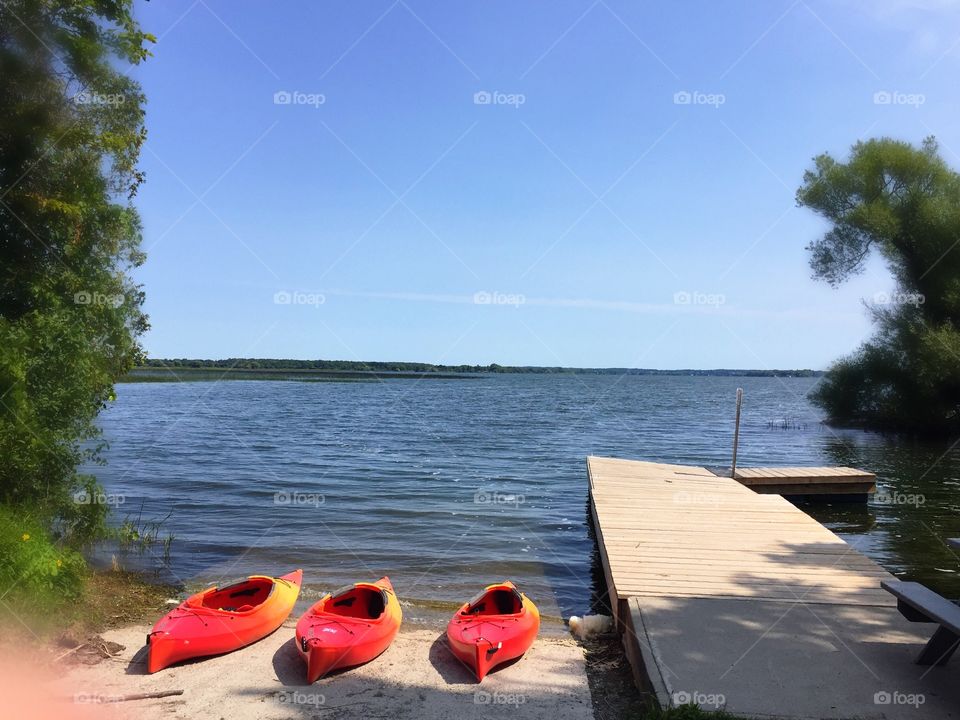 Three Red Kayaks by the lake