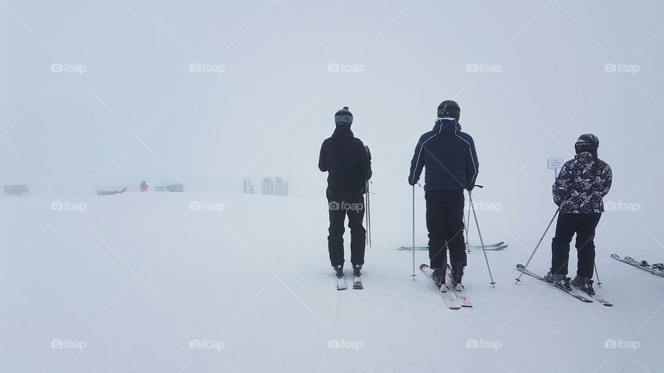 Rear view of people doing skiing