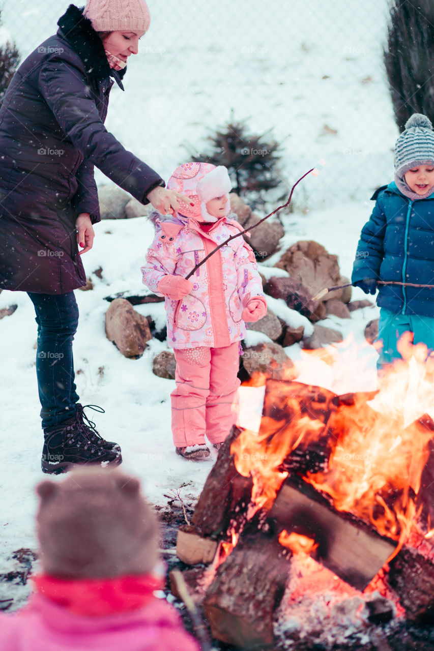 Winter with friends. Spending wintertime outdoors playing with snow