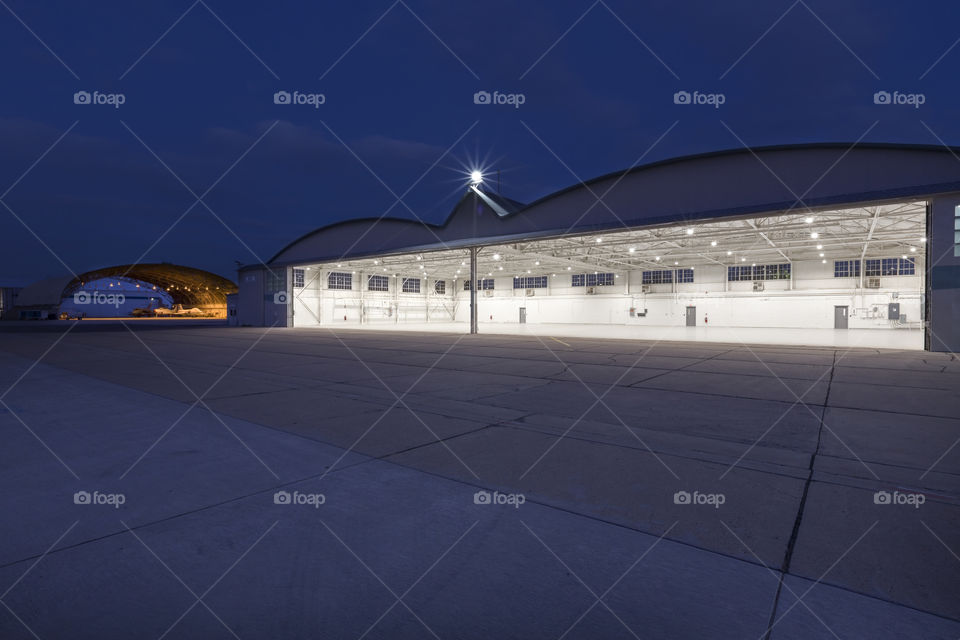 Airport Hangar Lit In Evening