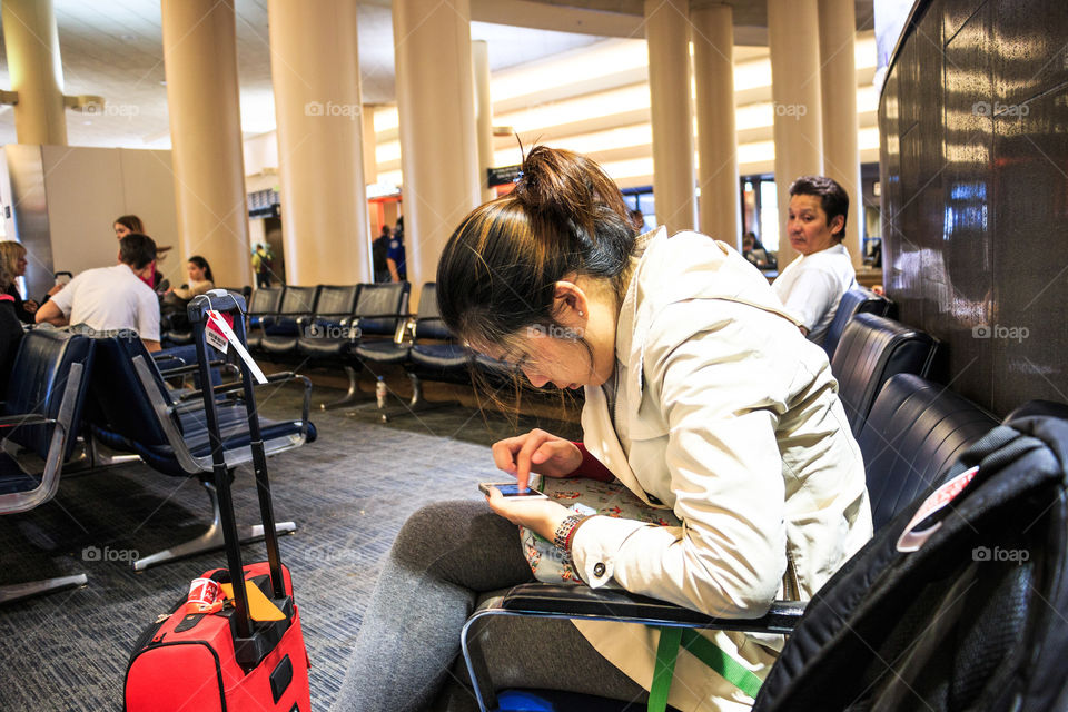 Girl playing smartphone 