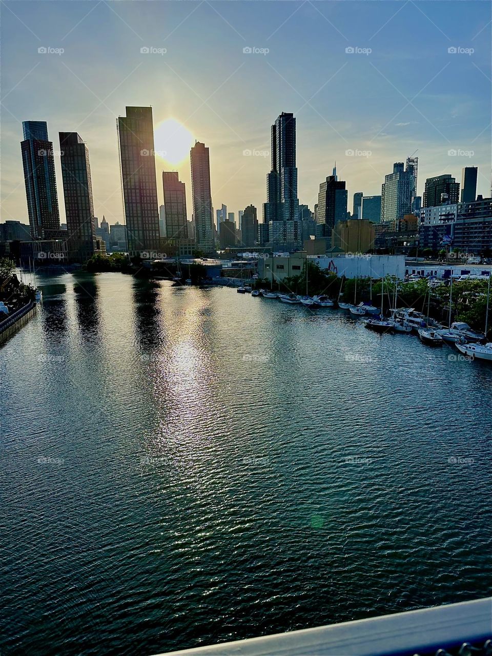 This is “Newtown Creek” seen from the “Pulaski Bridge” that connects “Greenpoint”, Bklyn to LIC, Queens. Across the “East River” in the distance we see “Manhattan”. 2024. Hypnotic Productions