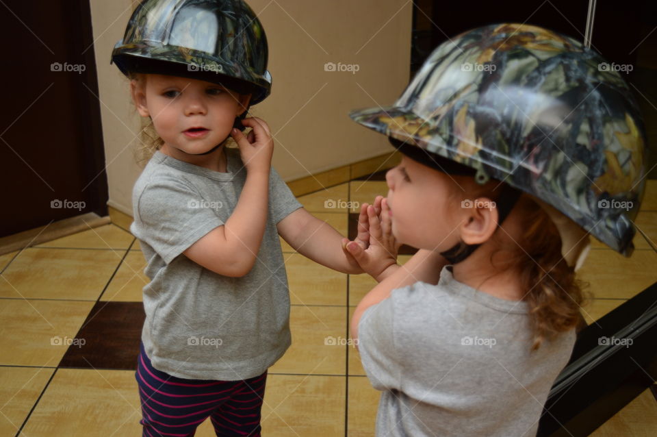 Child in unique helmet