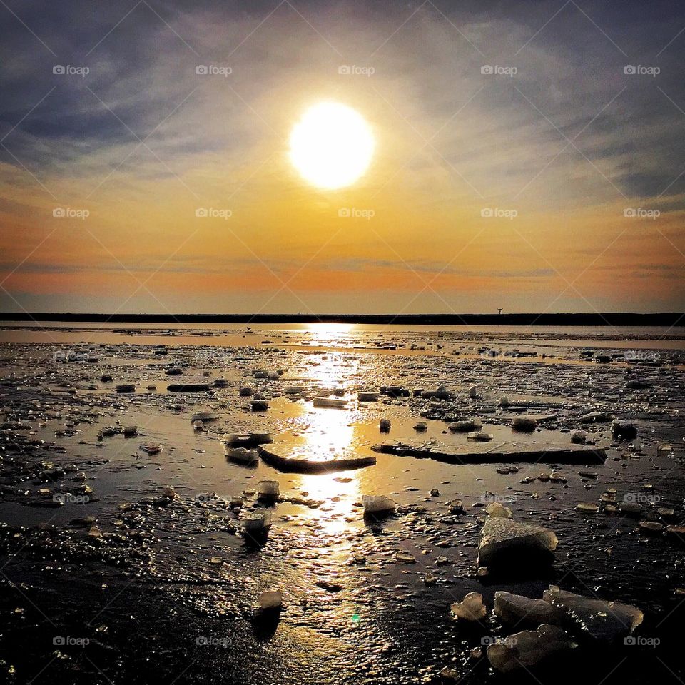 Sunset view at frozen sea