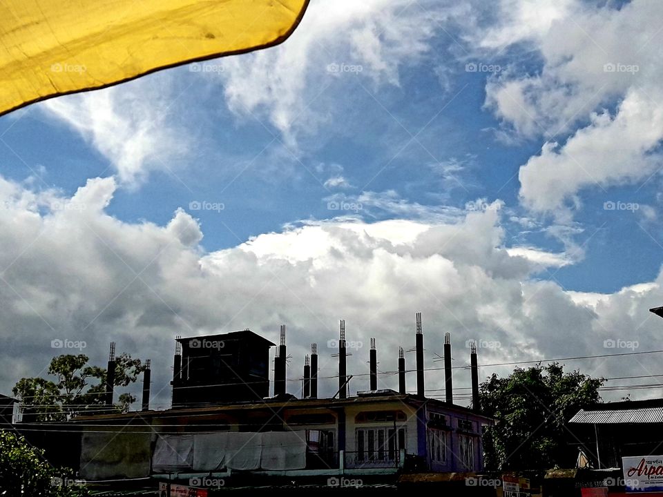 Blue sky white cloud under uncomplete building