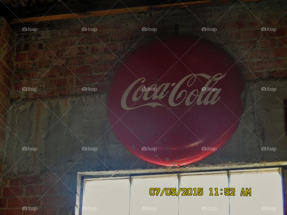 old 👵 Coca-Cola sign. This is a picture of a vintage Coca-Cola sign that I saw in a gift shop located in Graham Texas