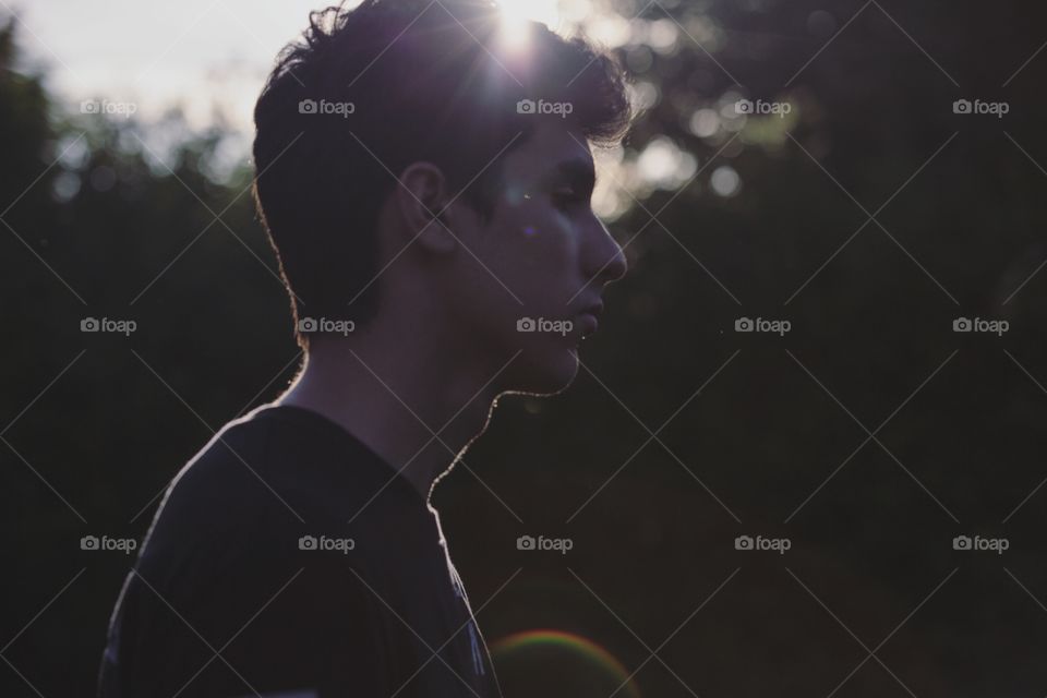 A young man and light rays