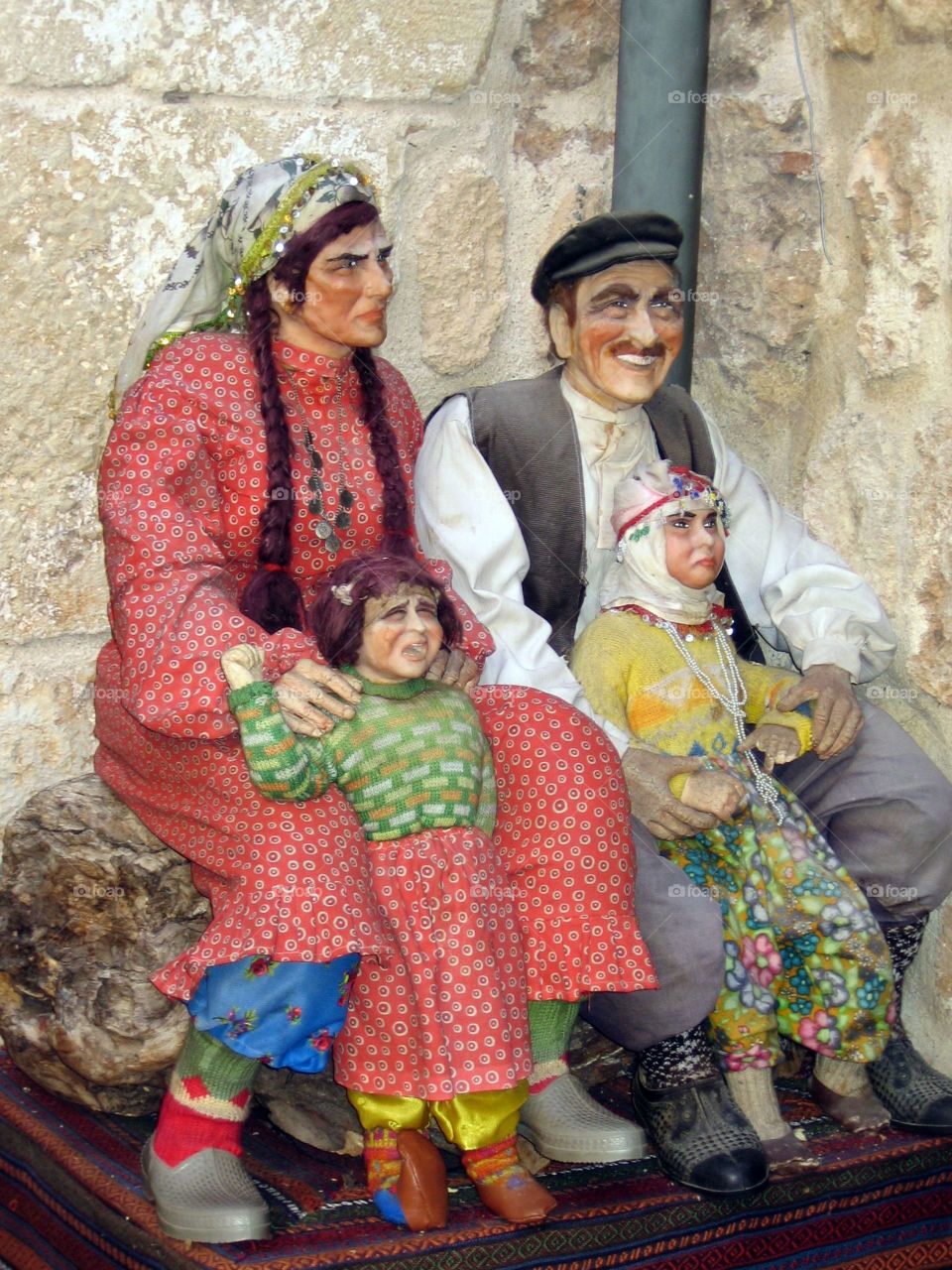 Sculpture woman male children peasants