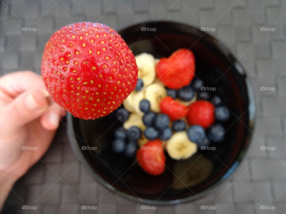 Breakfast with strawberry, banana and berries