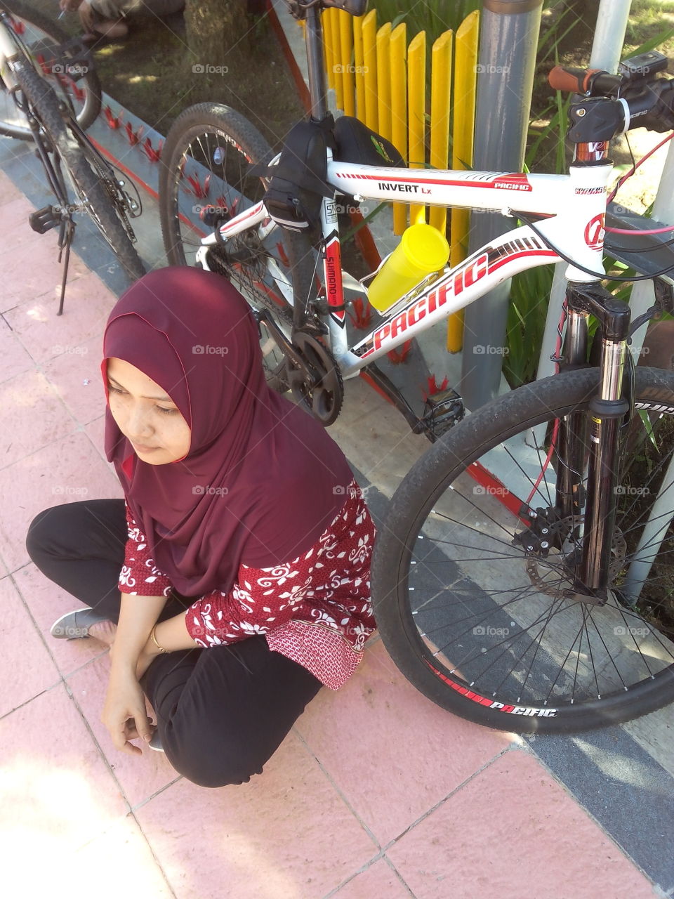 muslimah biker. my wife and her bicycle