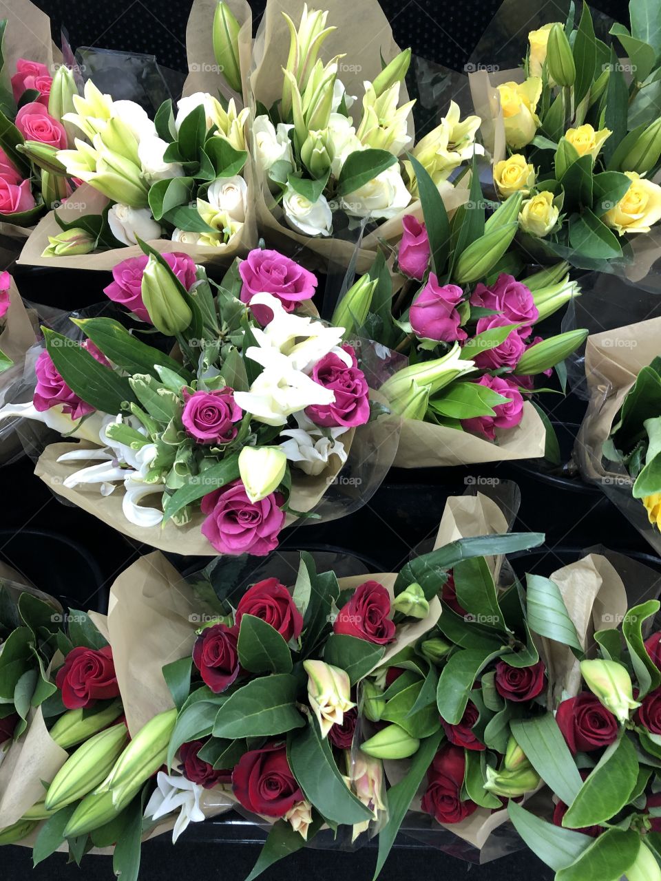 Many colorful flowers all compacted together in a beautiful display. 